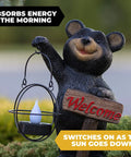 Bear Solar Powered LED Welcome Sign Garden Statue with lantern on grass, holding 'Welcome' sign, polyresin, outdoor decor