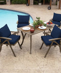 Outdoor Dining Chair Cushion Set 21 By 21 Inches In Sapphire Blue Rainproof And Fade Resistant Includes One Back Pillow And One Seat Bottom Eco Friendly PFAS Free C0 Treatment With Recycled Polyfill And Polyester Fill Fits Most Chairs installed on wooden chairs by a poolside table.