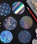 200 Piece Set For 2.25 Inch 58mm Button Makers Protective Film With Eight Glitter Styles displayed on a table