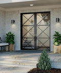 5 Inch Black Modern Outdoor Wall Lantern Light for Patio and Exterior, cylindrical design on brick wall by glass doors