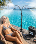 Outdoor Patio Mister System With Four-Gallon Water Bucket And Pump by a poolside, spraying mist, woman relaxing on a lounge chair