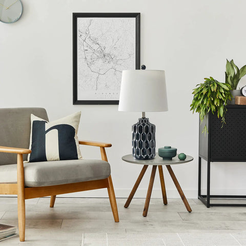Cozy living room with blue ceramic table lamp, handpainted white pattern, white fabric shade, easy rotary socket switch on side table.