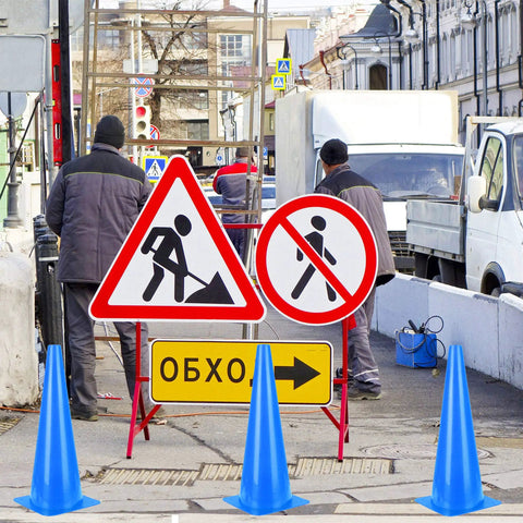Roadwork scene with blue cones and construction signs, workers nearby, not 28 Inch Collapsible Traffic Cones 2 Pack For Parking Lots And Driving Practice With Reflective Collars Orange Safety Cones Easy Foldable Pop Up Cones For Quick Emergency Parking Lot Setups In A Snap