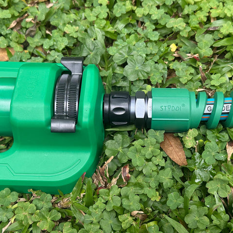 Heavy Duty Five Eighth Inch Garden Hose Fittings Kit Two Pack Metal Male Connectors With Bend Restrictor on grass