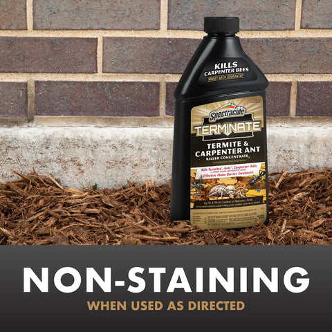 Termite And Carpenter Ant Killer Concentrate 32 Ounces Outdoor Barrier Spray bottle in garden mulch by home foundation