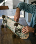 Person maintaining skateboard with Chrome Steel Bearings 8x22x7mm For Skateboards And Longboards, Tempered Steel Balls.