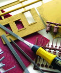 Swiss Pattern Needle File Set With Handle 12 Piece General Purpose File Kit for toolmakers and hobbyists on a workbench