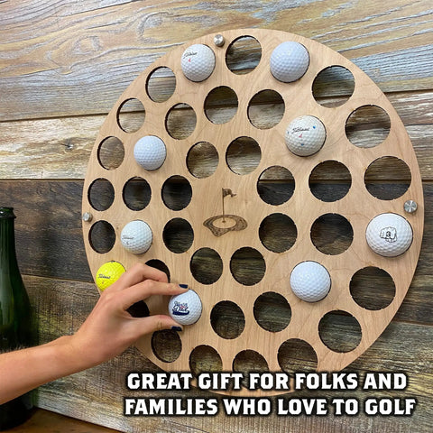 Charred Finish Golf Ball Display Holder And Collector Case Holds 42 Balls with hand placing ball, wall-mounted decor.