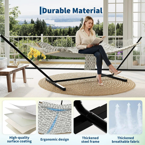 Two Person Hammock With Adjustable Steel Stand And Pillow For Easy Outdoor Lounging, Heavy Duty Portable Set, Handles Up To 450 Lbs, Perfect For Patio Garden Beach Backyard Camping And Chill Sessions set up in a living room with a woman sitting on it.