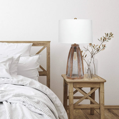 Vintage Farmhouse Wood Two Light Table Lamp With Netted Shade And Old Wood Base White Fabric Shade Dual Sockets 3 Way Bulb Capability Rotary Switch On Socket Rustic Charm For Living Room Or Hallway Cozy Farmhouse Vibe on bedside table