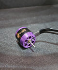 Capra Powder Keg Brushless Motor for UTB18 RC Rock Crawler on black surface, high torque performance with efficient cooling.