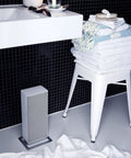 Anna White Large Ceramic Space Heater With Auto Shutoff Quiet Thermostat Control in modern bathroom setting