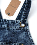 Close-up of blue-black denim apron straps with metal ring, featuring Denim Apron For Men With Towel Loop And Tool Pockets.
