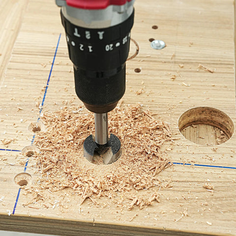 GMTOOLS Forstner bit drilling wood in a plywood board (carbide, front view)