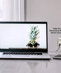 Electricity Usage Monitor With Big LCD Display Four Settings For Day Week Month And Year Power Tracking beside a laptop