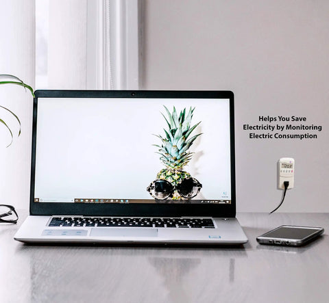 Electricity Usage Monitor With Big LCD Display Four Settings For Day Week Month And Year Power Tracking beside a laptop