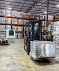 Heavy Duty Evaporative Air Cooler With Killer Cooling Power, Variable Speeds For Patios And Barns, Cools 2500 Square Feet Smooth in warehouse with stacked pallets.
