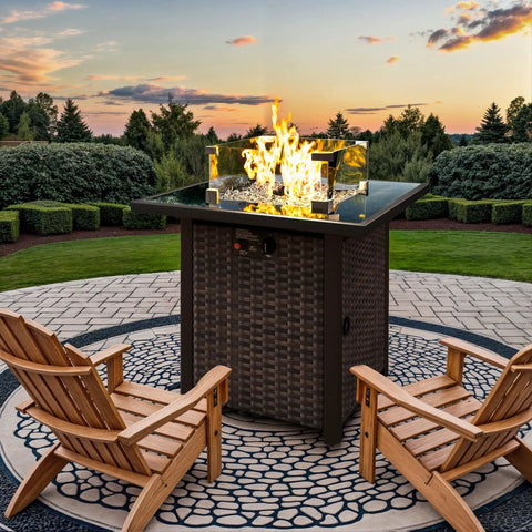 Outdoor Gas Fire Pit Table With 28 Inch Rattan Square Design Glass Wind Guard Tempered Glass Top Lid CSA Listed 50000 BTU Brown For Patio Deck And Garden in use on a patio with sunset view