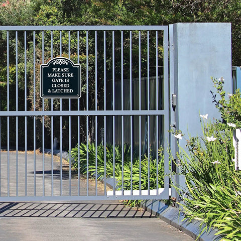 Top Shelf Outdoor Security Warning Placard Please Make Sure Gate Is Closed And Properly Latched on a gate surrounded by greenery.