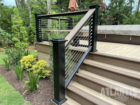 Outdoor deck with black and stainless steel rail cable railing tensioner set five thirty second inch swage fittings, angled stair view