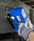 Person using Ultra Low Profile Right Angle Magnetic Drill Fabricator Kit on metal surface for precise cutting.