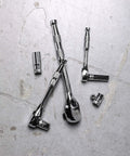 Full Polish Ratchet Set With One Quarter Inch, Three-Eighth Inch, And One Half Inch Drives, shown on concrete surface.