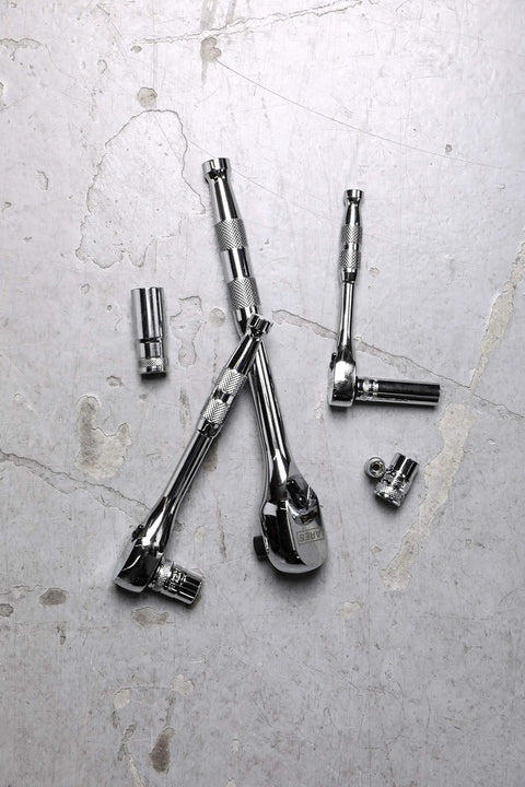 Full Polish Ratchet Set With One Quarter Inch, Three-Eighth Inch, And One Half Inch Drives, shown on concrete surface.