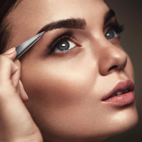 Using Pointed Tweezers Pro Grade High Carbon Stainless Steel Needle Nose Fine Point for precision hair removal on eyebrows.