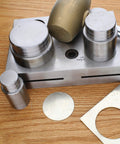 Pro Grade Circle Disc Cutter Set with four punches and die on wooden surface, includes 1, 1-1/4, 1-1/2, and 2 inch sizes.