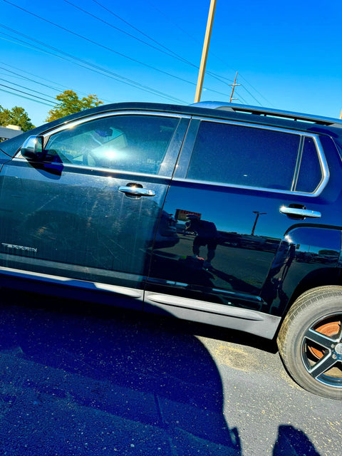 Shiny Car Stuff Hand-Applied Clear Coat: dark blue SUV side view with chrome trim and black alloy wheels.