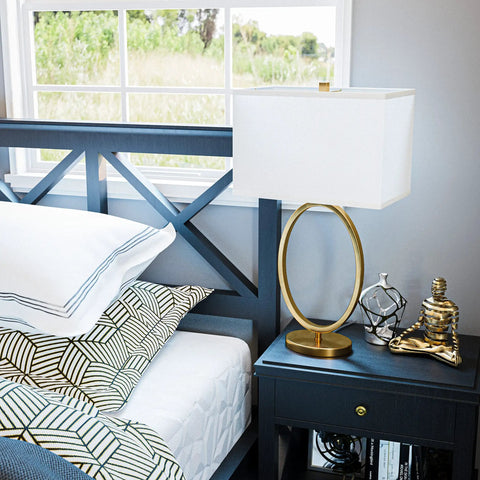 Oke Table Lamp With Gold Plated Finish, Modern Art Deco Open Round Frame, White Rectangular Shade on nightstand, bedroom view