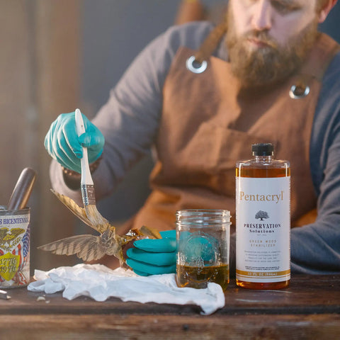 Person applying Pentacryl Green Wood Stabilizer For Fresh Cut Wood That Keeps It From Cracking And Shrinking Deep Penetration