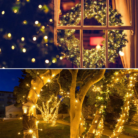 Outdoor Solar String Lights 39Ft 100 LED With 8 Modes Waterproof Warm White illuminating trees and window wreath