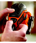 Quarter Sheet Orbital Palm Sander Professional Grade 220 Watt Motor showcasing pressure trigger switch in use.