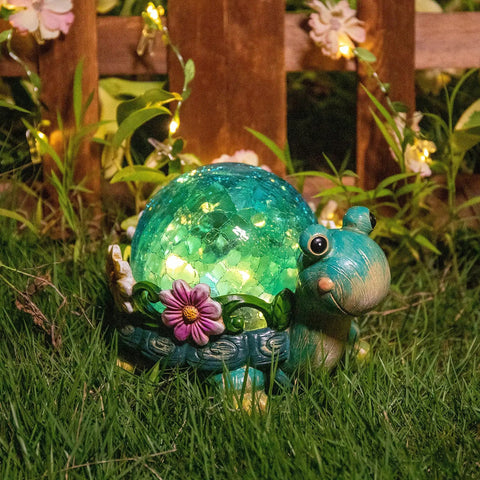 Garden Turtle Statue Outdoor Decor Resin Figurine With Glass Solar Lights glowing on grass at night