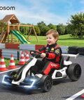 Child driving Dual Motor 24V Electric Go Kart for Kids 6-12 with Adjustable Seat Drift Mode in park, playground background
