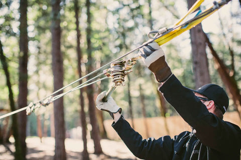 Person installing Zip Line Tensioning Kit With Beefy 2 Ton Ratchet Winch, Cable Grab For Three Sixteenths To Three Quarters Inch Cable.