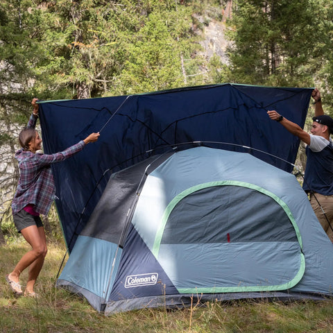 Skydome Camping Tent With Five Minute Setup Weatherproof 2, 4, 6, And 8 Person Shelter being set up in a forest