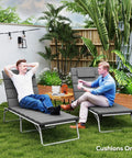 Two lounge chairs with Go-To Outdoor Lounge Chair Cushions Set Of 2, 80 By 26 Inches, UPF50 Plus Fade Resistant Olefin Fabric in garden.