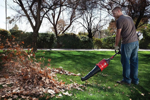 Man using High Performance Blower Attachment With Concentrator For Attachment Capable Trimmers Polesaws to clear leaves