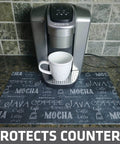 Coffee Bar Mat For Espresso Station Protects Countertops From Spills And Scratches With Absorbent Waterproof Washable Construction Sized 12 By 20 Inches USA Made Java Chalkboard Design under a coffee maker.
