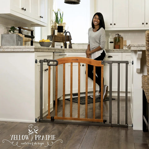 Decorative Walk-Thru Baby And Pet Gate For Openings Up To 60 Inches, 30 Inch Tall With Walnut Wood And Charcoal Metal Accents in kitchen