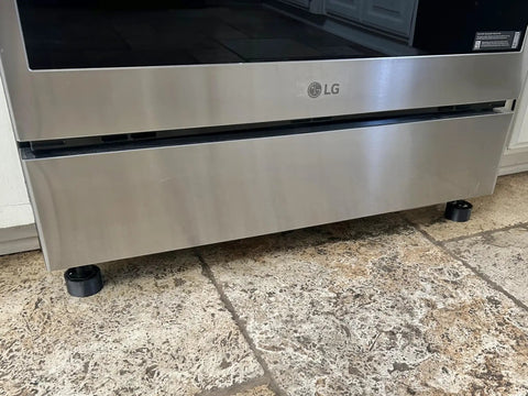 Front view of a range with Beefy Non Slip Range Foot Extension Risers Two Pack Height Boost Three Quarters Inch Front Feet installed