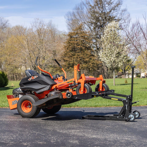 Guardian zero-turn lawn mower lift jack with black steel frame lifting an orange mower; 550 lb capacity, 27 in height.