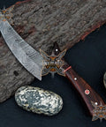 Beast Damascus Steel Skinner Knife With Wood Handle Fixed Blade Outdoor Hunting Knife With Leather Sheath on rock background.