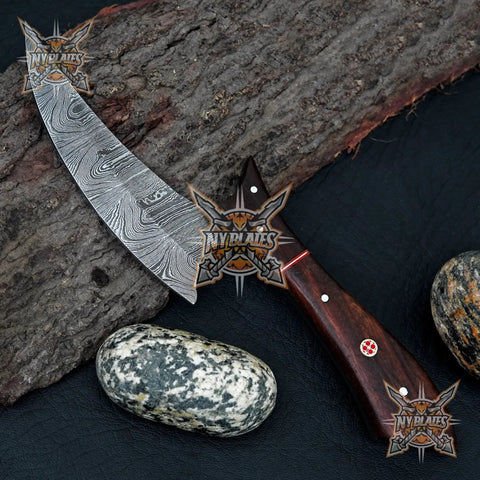 Beast Damascus Steel Skinner Knife With Wood Handle Fixed Blade Outdoor Hunting Knife With Leather Sheath on rock background.