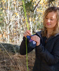 Person setting up Bear Bag Food Hanging System For Camping And Hiking With 2 To 1 Pulley Waterproof Food Bag and Rock Sok