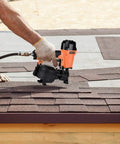 Person using CN45C 3/4-Inch To 1-3/4-Inch Coil Roofing Nailer with 15-Degree Drive and 120-Nail Magazine on roof