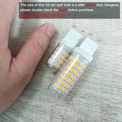 Close-up of No Flicker G9 LED Bulbs 6W Dimmable 2700K with soft warm white light next to a hand for size comparison on a wooden surface.