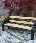 DIY Bench Ends Kit For Outdoor And Patio Benches, black finish, assembled with 2x4s in snowy garden, fall season